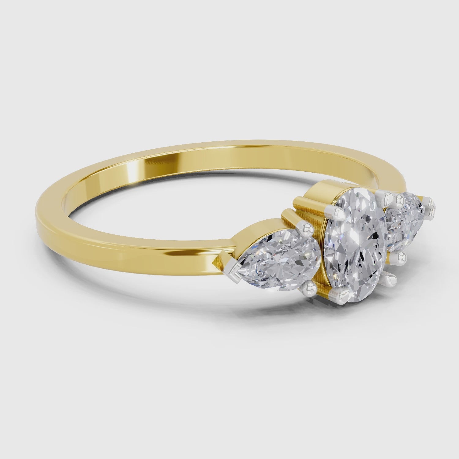 Load video: 0.60 Carat Three-Stone Oval &amp; Pear Diamond Engagement Ring | 14K Yellow Gold